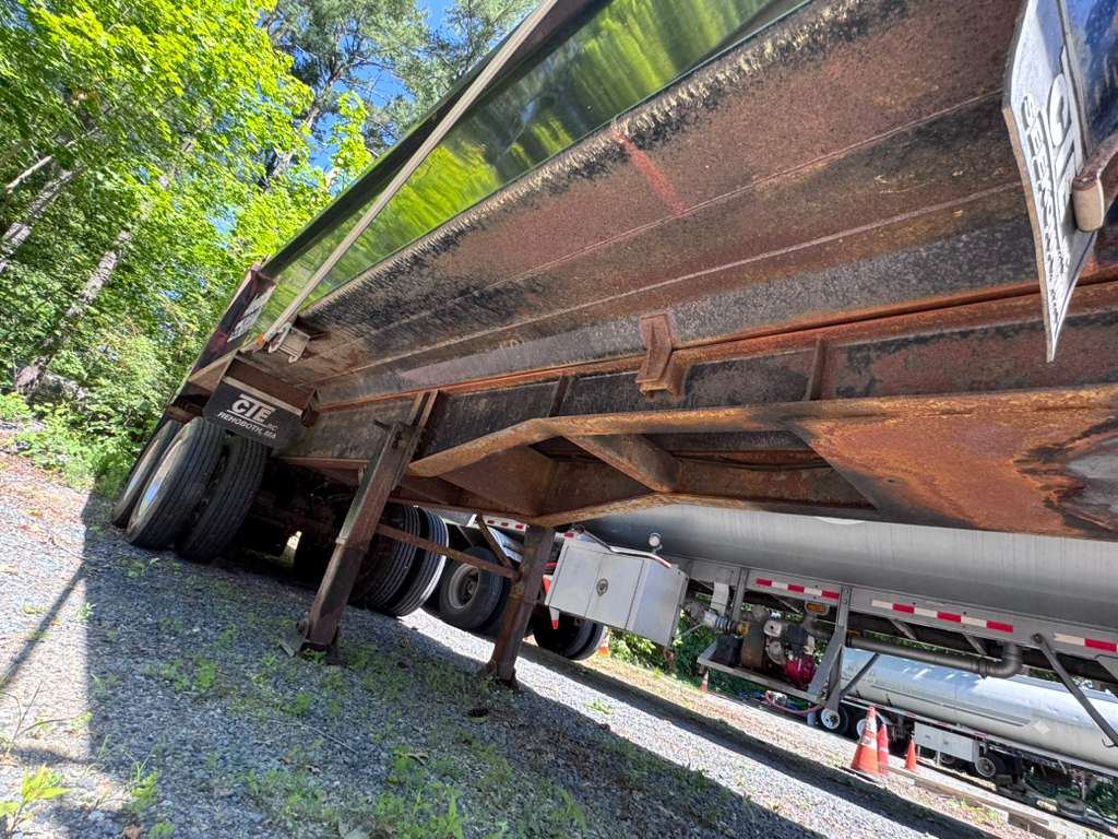 Rusty trailer frame before sandblasting